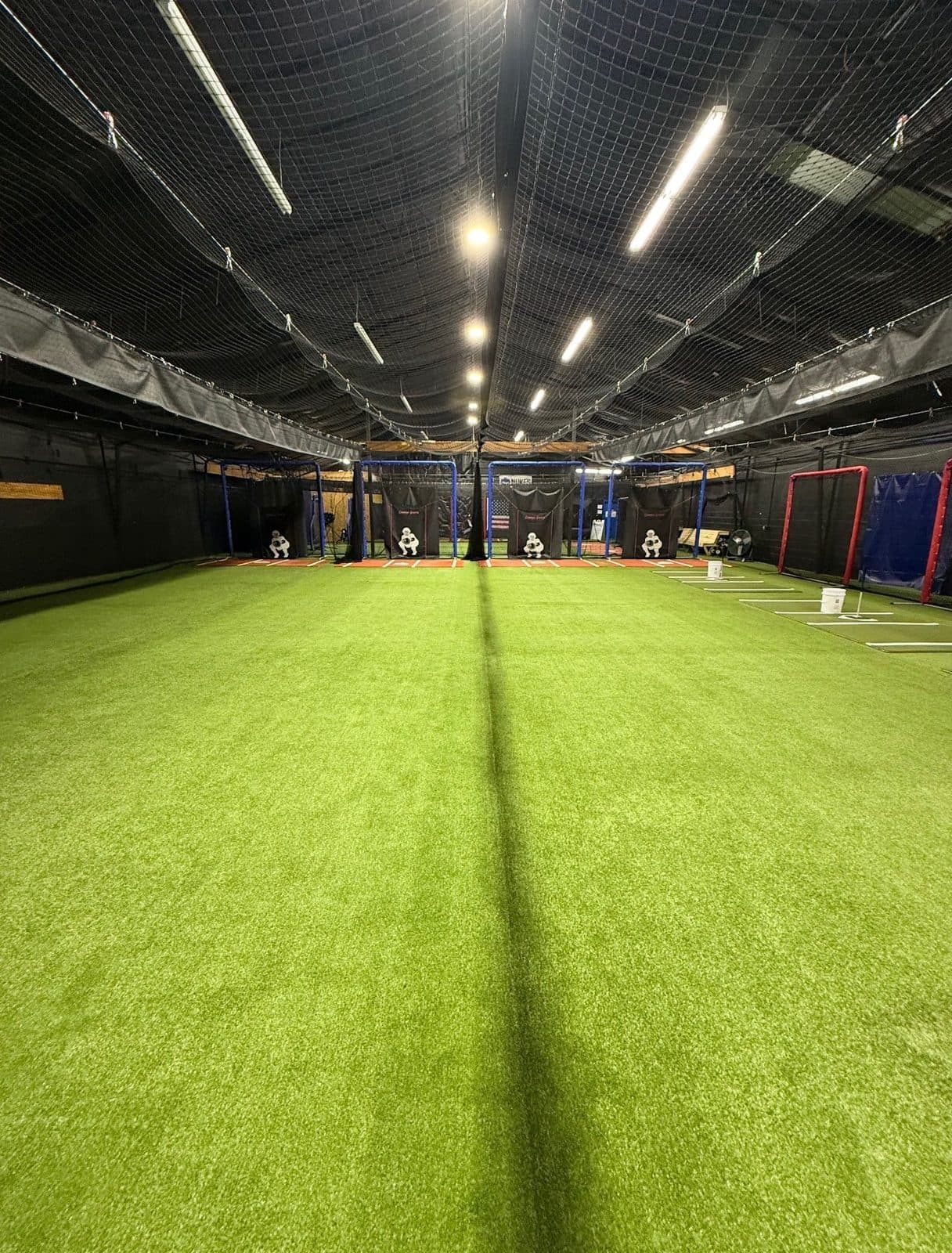 Center turf runway between the batting tunnels