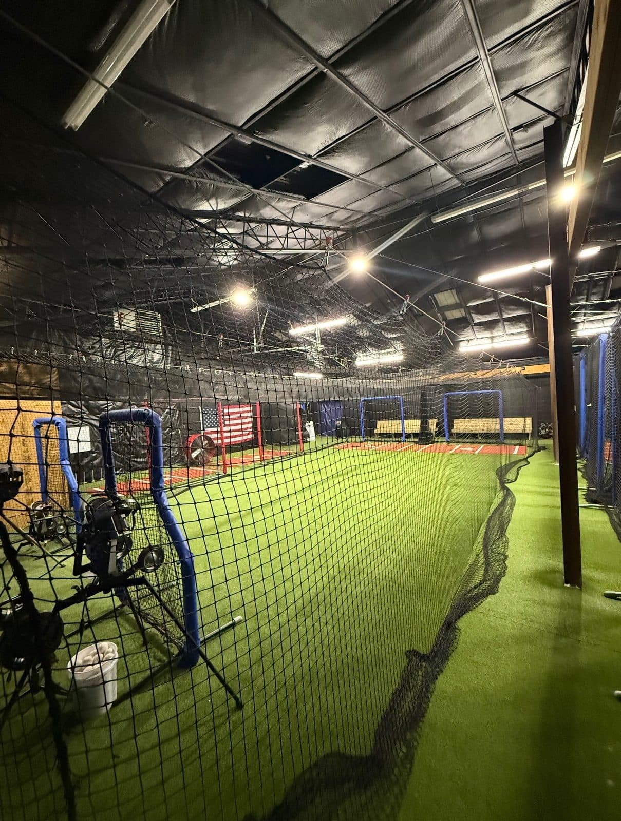 Turf training area viewed through the tunnel netting